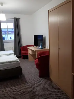 Ein Bett oder Betten in einem Zimmer der Unterkunft Ritterhof Kampehl