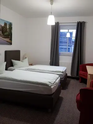 Ein Bett oder Betten in einem Zimmer der Unterkunft Ritterhof Kampehl