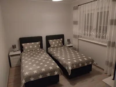 Ein Bett oder Betten in einem Zimmer der Unterkunft Ferienwohnung Lindenblick