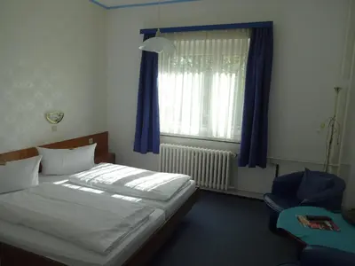 Ein Bett oder Betten in einem Zimmer der Unterkunft Hotel Süden