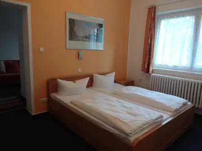 Ein Bett oder Betten in einem Zimmer der Unterkunft Hotel Süden