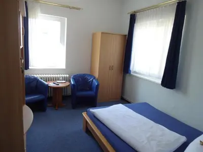 Ein Bett oder Betten in einem Zimmer der Unterkunft Hotel Süden