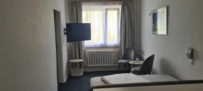 Ein Bett oder Betten in einem Zimmer der Unterkunft Hotel Süden