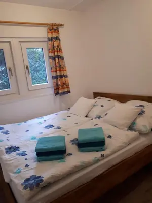 Ein Bett oder Betten in einem Zimmer der Unterkunft Ferienhaus am Langen See III