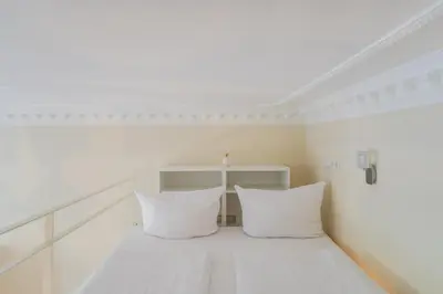 Ein Bett oder Betten in einem Zimmer der Unterkunft Urban Comic Kreuzberg