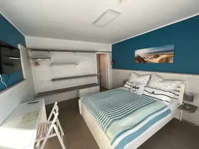 Ein Bett oder Betten in einem Zimmer der Unterkunft Pension Wernicke-Das-Original