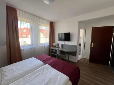 TV/Unterhaltungsangebot in der Unterkunft Pension am Markt