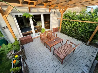 Ein Garten an der Unterkunft Ferienwohnung im Stadtzentrum von Bernau - Komfortable Wohnung mit 2 Zimmern, Bad, Spülmaschine, Waschmaschine, komplette Küche, WLAN, Terrasse, ruhige Lage