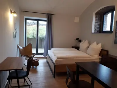 Ein Bett oder Betten in einem Zimmer der Unterkunft Pension in der Alten Mälzerei