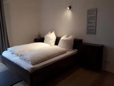 Ein Bett oder Betten in einem Zimmer der Unterkunft Pension in der Alten Mälzerei