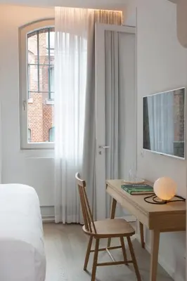 Ein Bett oder Betten in einem Zimmer der Unterkunft Wilmina Hotel