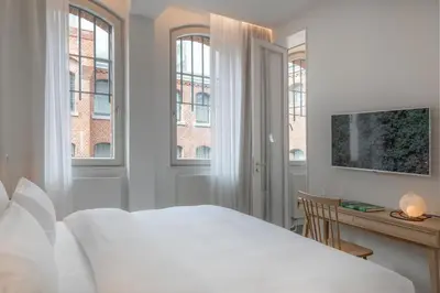 Ein Bett oder Betten in einem Zimmer der Unterkunft Wilmina Hotel