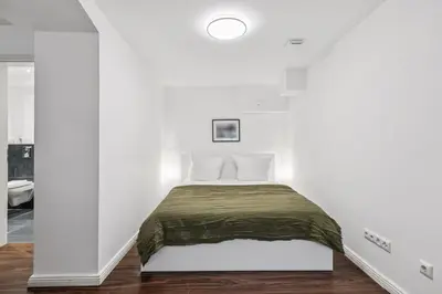 Ein Bett oder Betten in einem Zimmer der Unterkunft Arbio I Stylish Apart Schöneberg S-Bahn