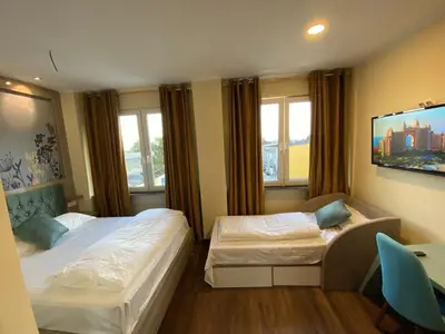 Ein Bett oder Betten in einem Zimmer der Unterkunft Hotel Grand Inn