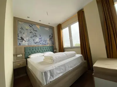 Ein Bett oder Betten in einem Zimmer der Unterkunft Hotel Grand Inn