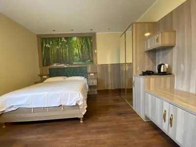 Ein Bett oder Betten in einem Zimmer der Unterkunft Hotel Grand Inn