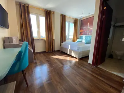 Ein Bett oder Betten in einem Zimmer der Unterkunft Hotel Grand Inn