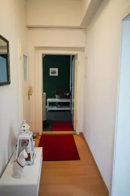 Ein Bett oder Betten in einem Zimmer der Unterkunft Cafe Alice & Pension GmbH
