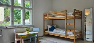 Ein Bett oder Betten in einem Zimmer der Unterkunft Kleines Landhaus am Wald Bad Saarow