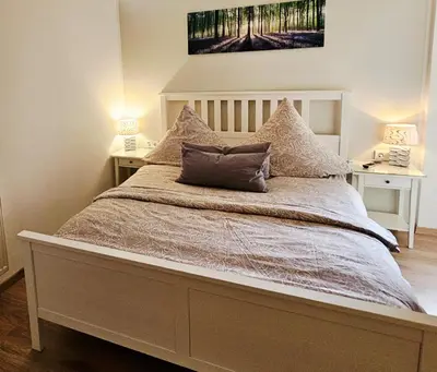 Ein Bett oder Betten in einem Zimmer der Unterkunft Ferienwohnung Inselblüte
