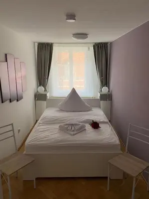 Ein Bett oder Betten in einem Zimmer der Unterkunft Ferienwohnung Nikolaiblick