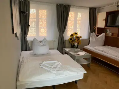 Ein Bett oder Betten in einem Zimmer der Unterkunft Ferienwohnung Nikolaiblick