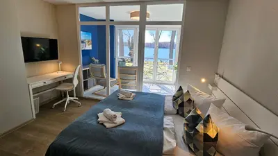 Ein Bett oder Betten in einem Zimmer der Unterkunft Apartment am See Bad Saarow