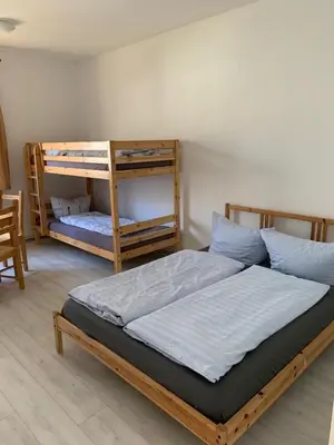Ein Bett oder Betten in einem Zimmer der Unterkunft Tauchbasis Stechlin