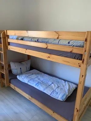 Ein Bett oder Betten in einem Zimmer der Unterkunft Tauchbasis Stechlin