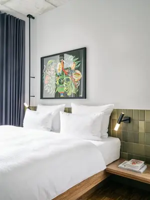 Ein Bett oder Betten in einem Zimmer der Unterkunft URBAN LOFT Berlin