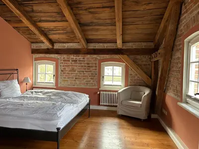 Ein Bett oder Betten in einem Zimmer der Unterkunft Storchenhof Blumenow
