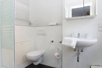 Ein Badezimmer in der Unterkunft New Green Apartments