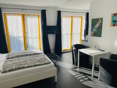 Ein Bett oder Betten in einem Zimmer der Unterkunft New Green Apartments
