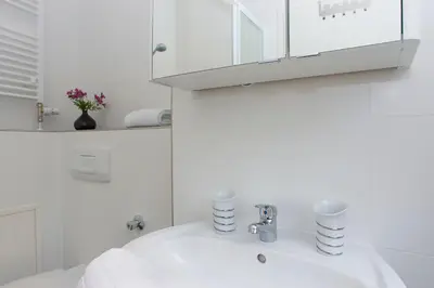 Ein Badezimmer in der Unterkunft New Green Apartments