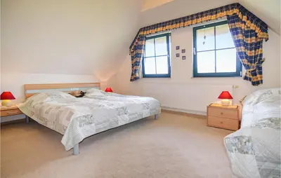 Ein Bett oder Betten in einem Zimmer der Unterkunft Ferienhaus Wendisch-Rietz Rohrweihe, Luisenaue III