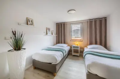 Ein Bett oder Betten in einem Zimmer der Unterkunft modernes Ferienhaus Sonnendeck 70 QM I Strandnah I Terrasse I 2 Schlafzimmer I Nähe Werbellinsee