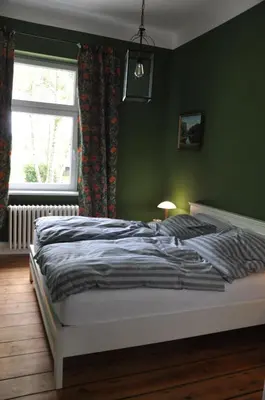 Ein Bett oder Betten in einem Zimmer der Unterkunft Villa Osterloff