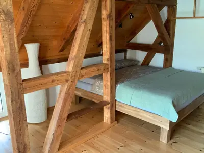 Ein Bett oder Betten in einem Zimmer der Unterkunft Lutki Dom