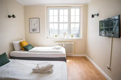 Ein Bett oder Betten in einem Zimmer der Unterkunft Alte Feuerwache
