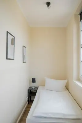 Ein Bett oder Betten in einem Zimmer der Unterkunft Alte Feuerwache