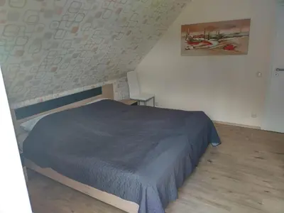 Ein Bett oder Betten in einem Zimmer der Unterkunft Ferienwohnung 
