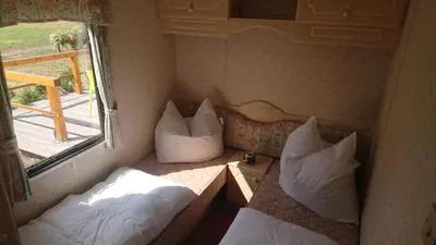 Ein Bett oder Betten in einem Zimmer der Unterkunft Mobilheim Monika