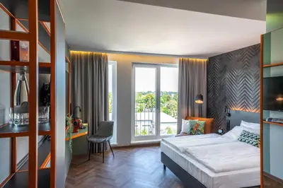Ein Bett oder Betten in einem Zimmer der Unterkunft LOGINN Hotel Berlin Airport