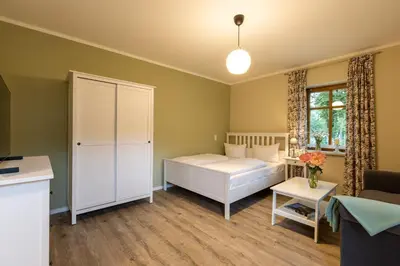 Ein Bett oder Betten in einem Zimmer der Unterkunft Ferienwohnungen Wildau am Werbellinsee