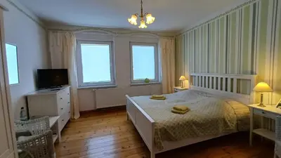 Ein Bett oder Betten in einem Zimmer der Unterkunft Ferienwohnung Steckelsdorf
