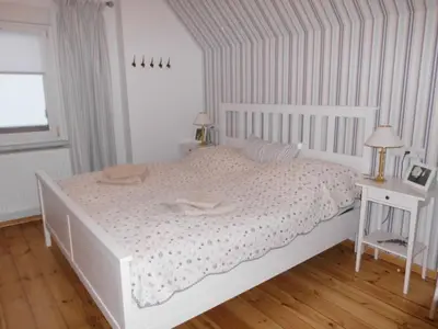 Ein Bett oder Betten in einem Zimmer der Unterkunft Ferienwohnung Steckelsdorf