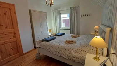 Ein Bett oder Betten in einem Zimmer der Unterkunft Ferienwohnung Steckelsdorf