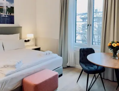 Ein Bett oder Betten in einem Zimmer der Unterkunft Elisapart - Apartments am Sommerschloss