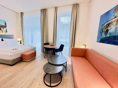 Ein Bett oder Betten in einem Zimmer der Unterkunft Elisapart - Apartments am Sommerschloss