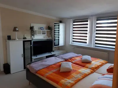 Ein Bett oder Betten in einem Zimmer der Unterkunft Dachstübchen an der Oder